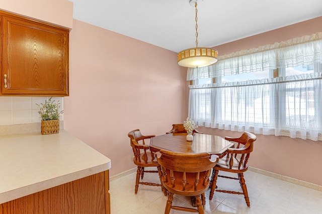 dining space with baseboards