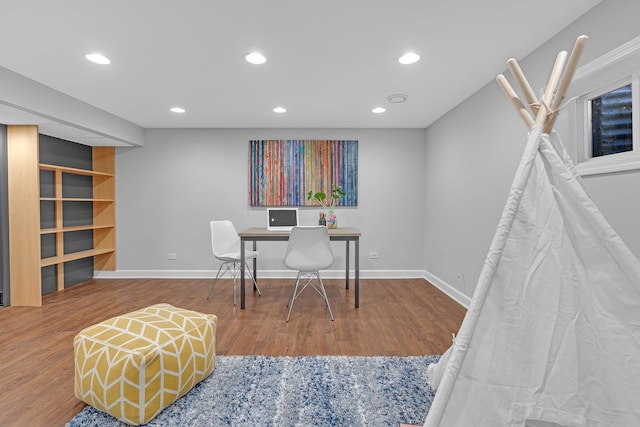 office space with recessed lighting, baseboards, and wood finished floors