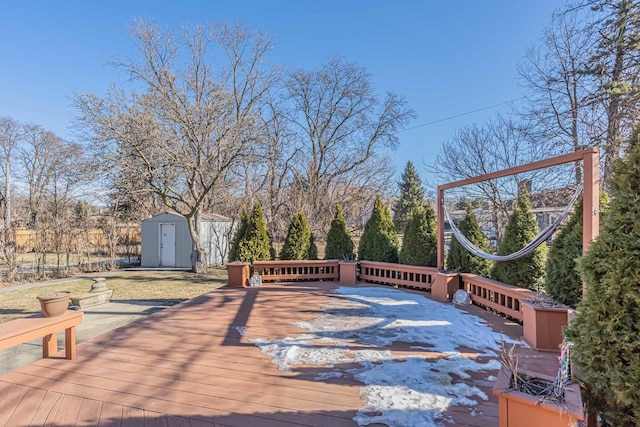 deck with an outdoor structure and a storage shed