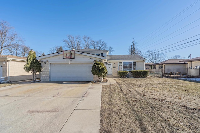 view of front facade with an attached garage, fence, concrete driveway, and brick siding