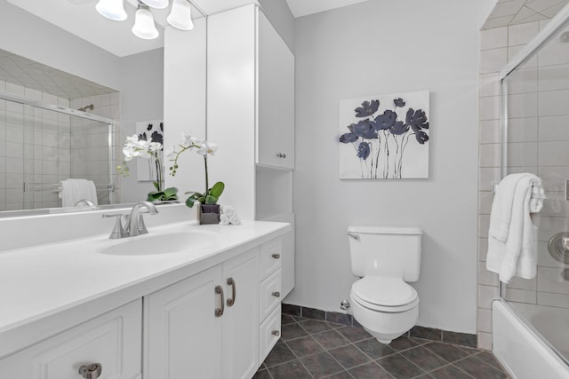 bathroom featuring tiled shower / bath combo, vanity, toilet, and tile patterned floors