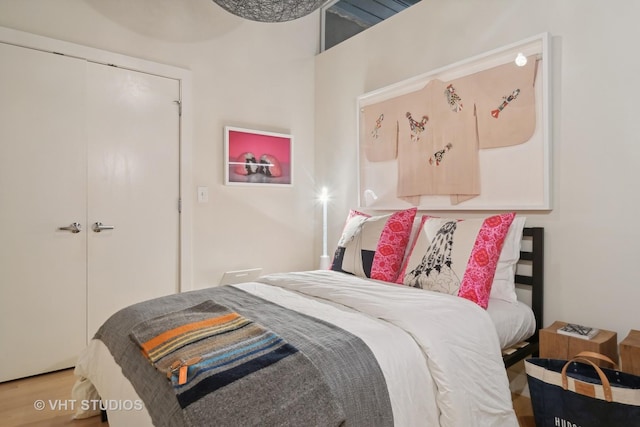 bedroom featuring a closet and wood finished floors