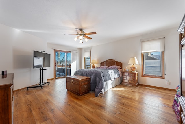 bedroom featuring light wood-type flooring, access to exterior, ceiling fan, and baseboards