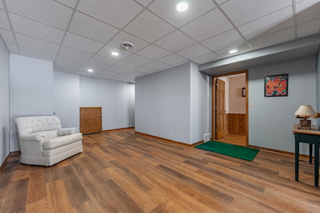 sitting room featuring visible vents, baseboards, and wood finished floors