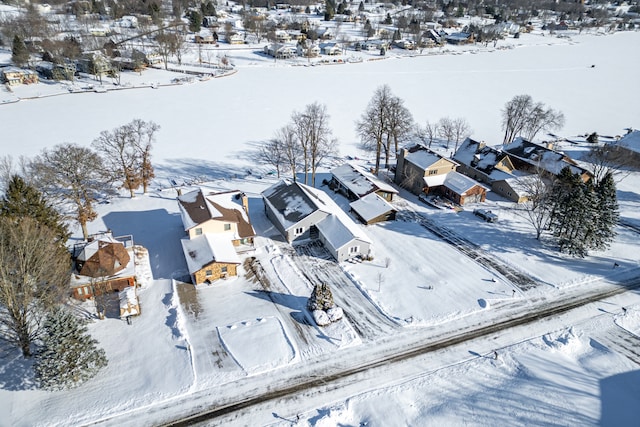 snowy aerial view featuring a residential view