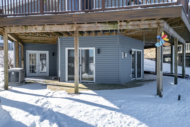 snow covered patio with french doors