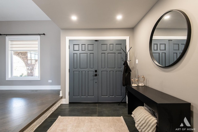 entrance foyer with recessed lighting and baseboards