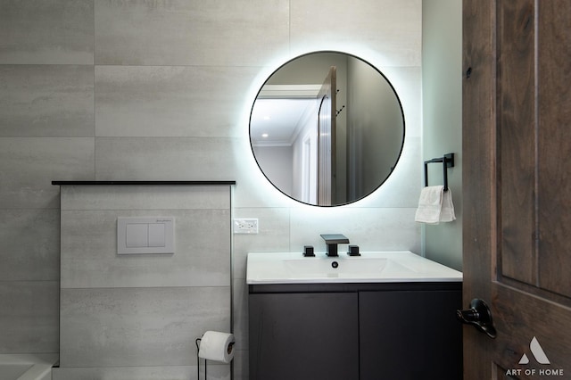 bathroom with ornamental molding and vanity