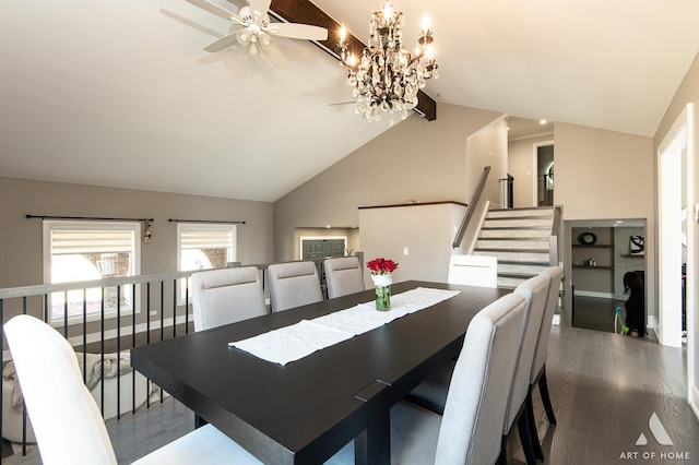 dining room featuring dark wood finished floors, a chandelier, high vaulted ceiling, and stairs