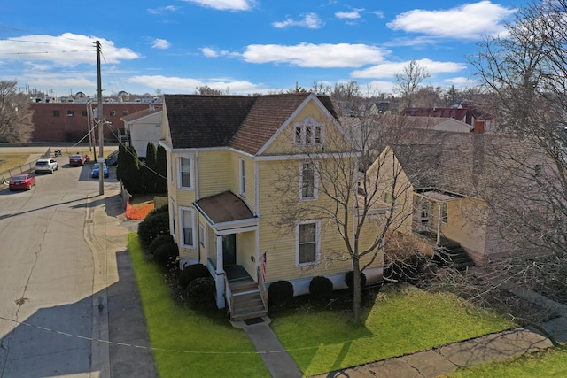 exterior space with a shingled roof