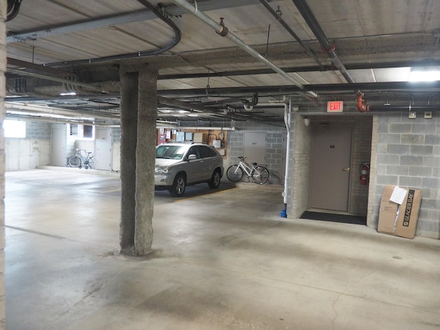 parking deck featuring concrete block wall