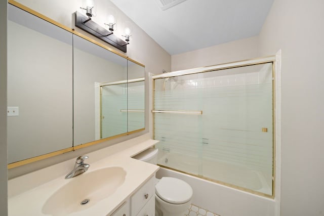 bathroom with combined bath / shower with glass door, vanity, and toilet