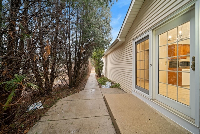 view of side of property with a patio