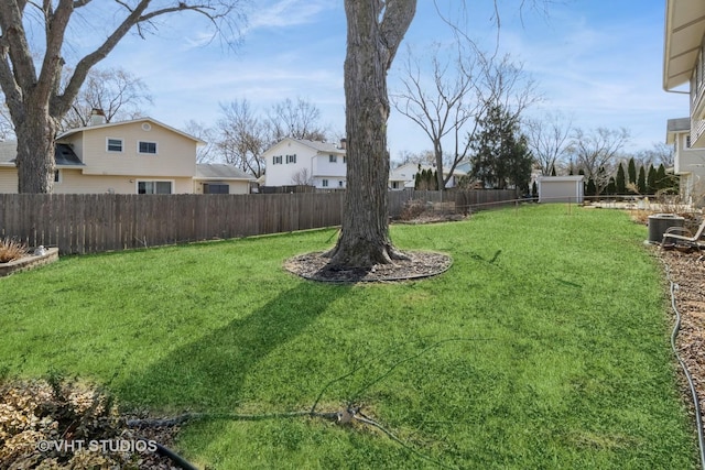 view of yard with cooling unit and a fenced backyard