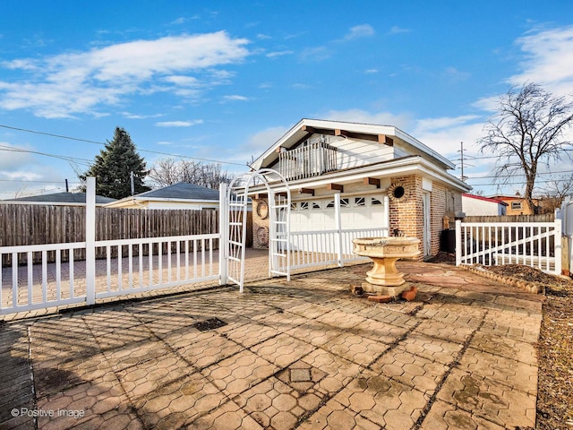 exterior space with brick siding and fence