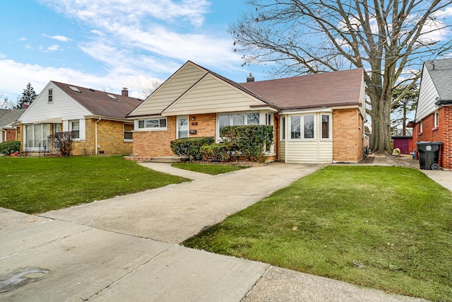 bungalow-style home with a shingled roof, a front yard, brick siding, and a chimney