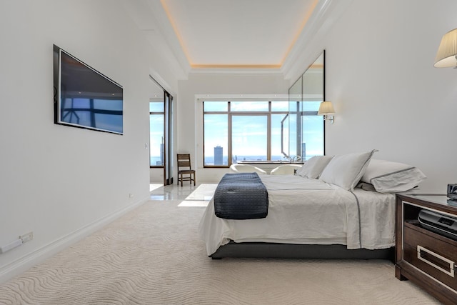 carpeted bedroom with baseboards and ornamental molding