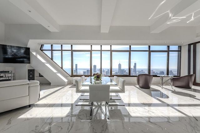 living room featuring recessed lighting, beamed ceiling, a view of city, and marble finish floor