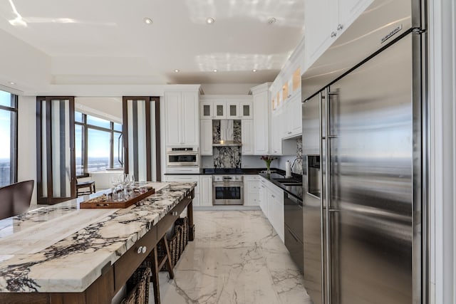 175 E Delaware Pl Unit 9106-07Ph, Chicago, IL 60611 - kitchen with a healthy amount of sunlight, built in fridge, white cabinetry, and recessed lighting