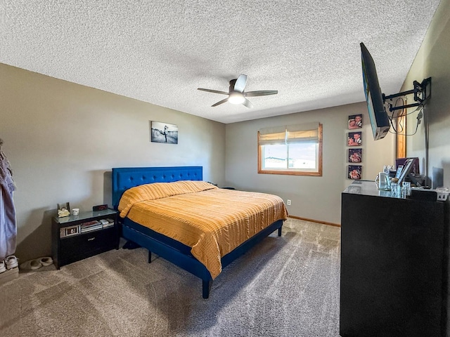 carpeted bedroom featuring a textured ceiling, a ceiling fan, and baseboards