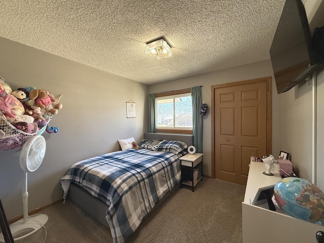 bedroom featuring carpet floors, a textured ceiling, and baseboards