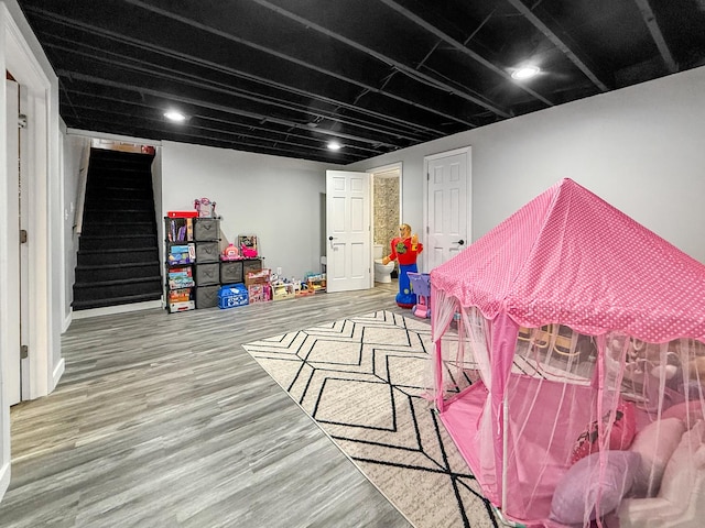 game room with wood finished floors