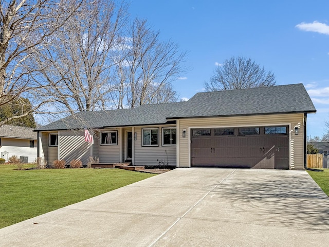 ranch-style home featuring concrete driveway, a front lawn, an attached garage, and a shingled roof