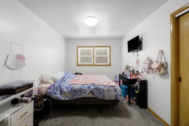 carpeted bedroom with baseboards