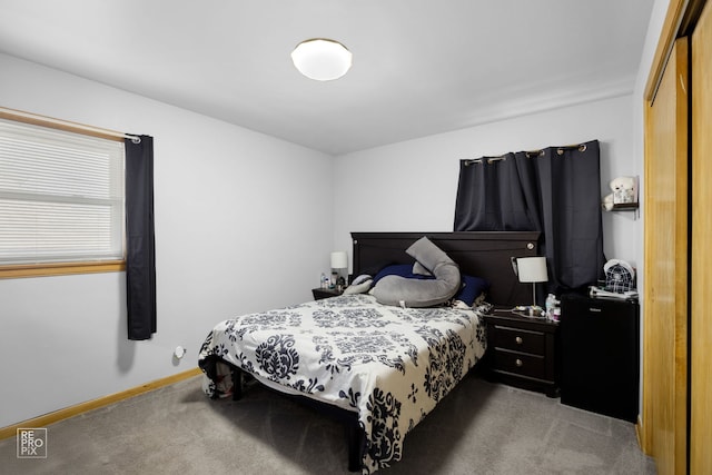 bedroom featuring carpet floors and baseboards