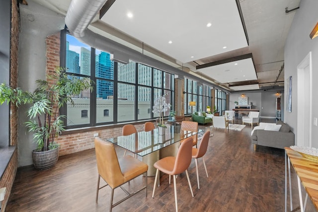 dining space featuring wood finished floors and recessed lighting