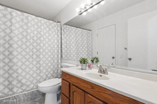 full bathroom with vanity and toilet