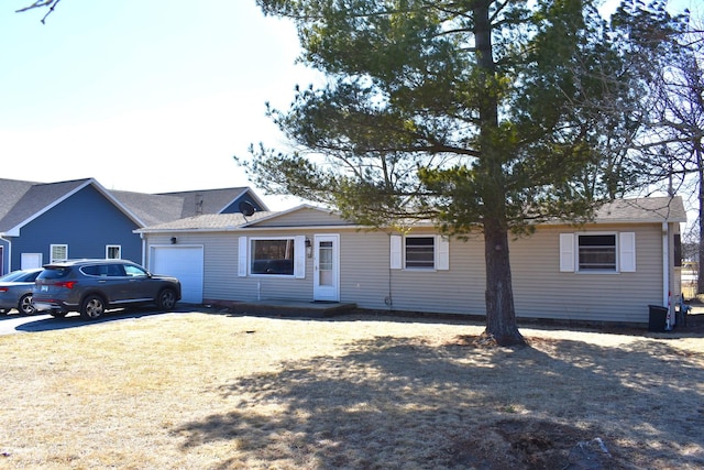 ranch-style house featuring a garage