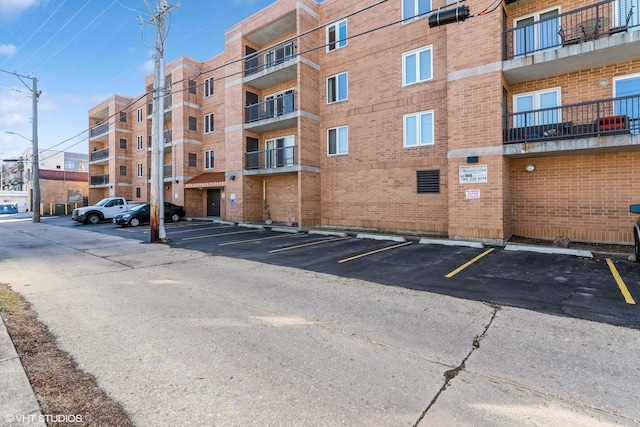 view of property featuring uncovered parking