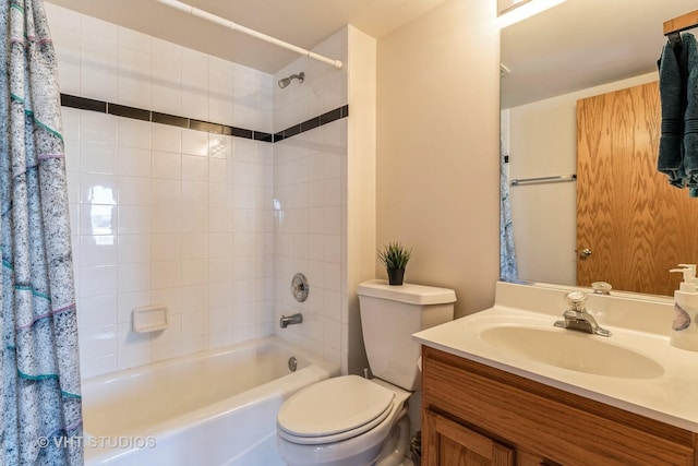 bathroom featuring vanity, toilet, and shower / tub combo