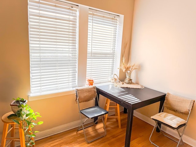 interior space featuring baseboards and wood finished floors