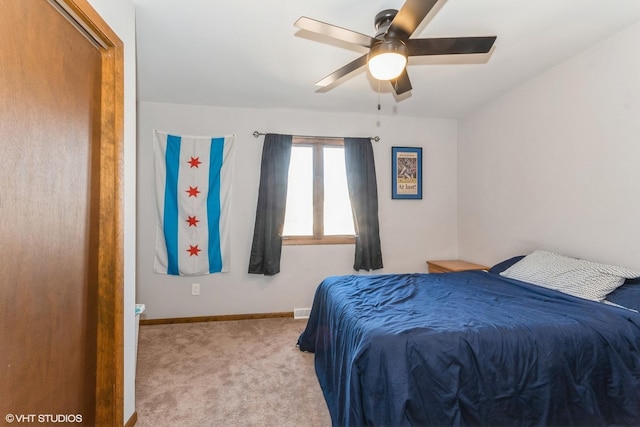 carpeted bedroom with baseboards and ceiling fan