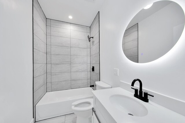 bathroom featuring bathtub / shower combination, vanity, and toilet