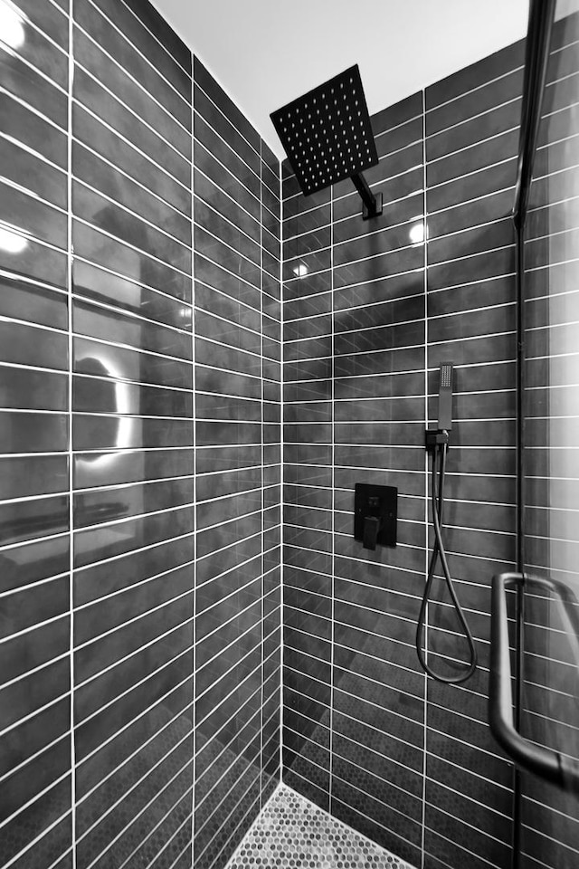 full bathroom with tiled shower