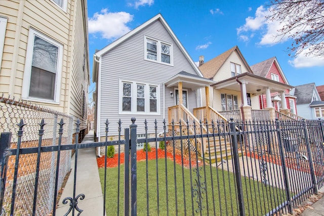 bungalow-style home with a fenced front yard and a front yard