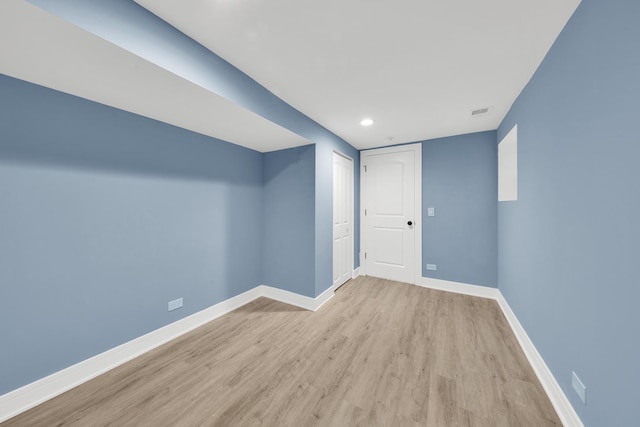 interior space with light wood finished floors, visible vents, baseboards, and recessed lighting