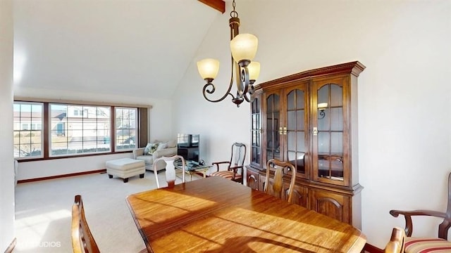 dining room featuring baseboards, carpet floors, high vaulted ceiling, and a chandelier