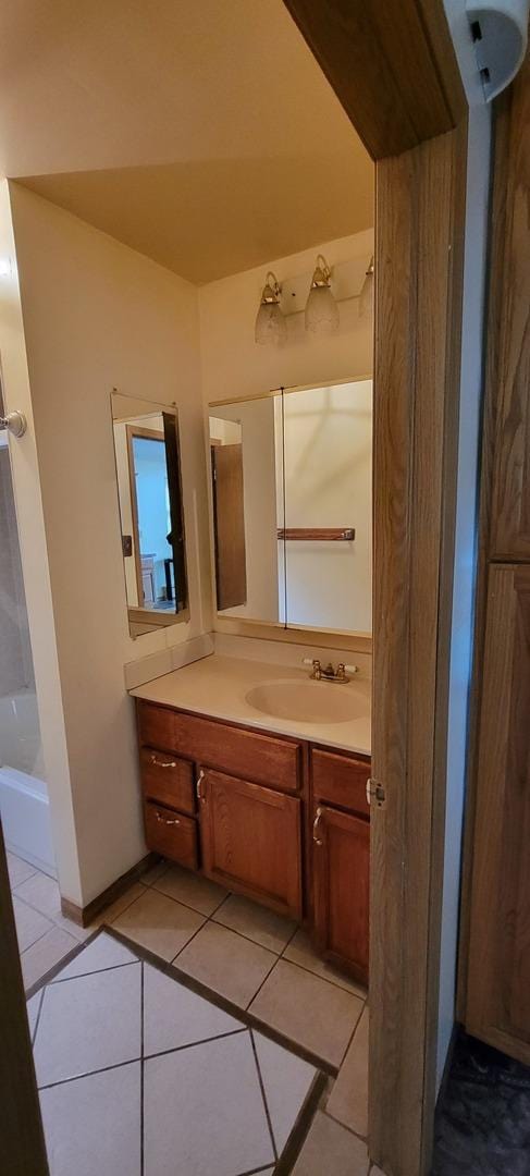 bathroom with tile patterned flooring and vanity