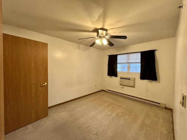 unfurnished bedroom with baseboards, a ceiling fan, a wall unit AC, a baseboard radiator, and carpet floors