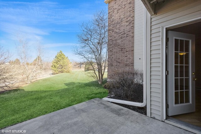 view of patio with an AC wall unit