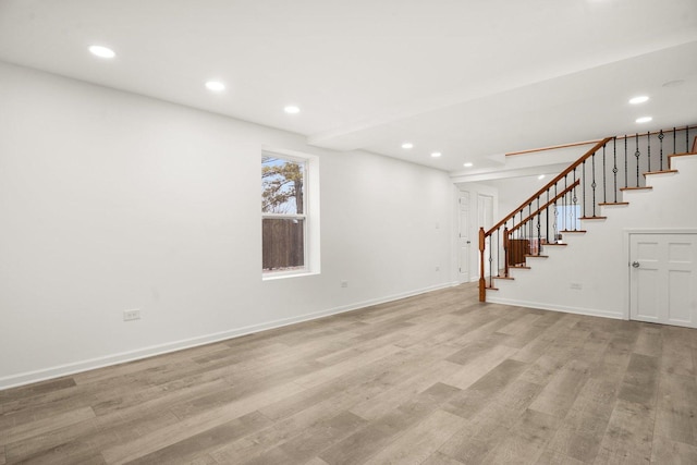 interior space with stairway, recessed lighting, baseboards, and light wood-style floors