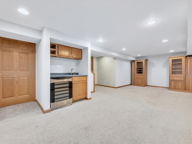 bar with indoor wet bar, wine cooler, recessed lighting, and baseboards