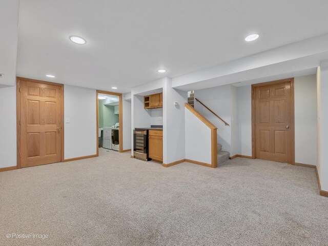 finished basement with stairway, recessed lighting, light colored carpet, and baseboards