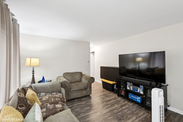 living room featuring baseboards and wood finished floors