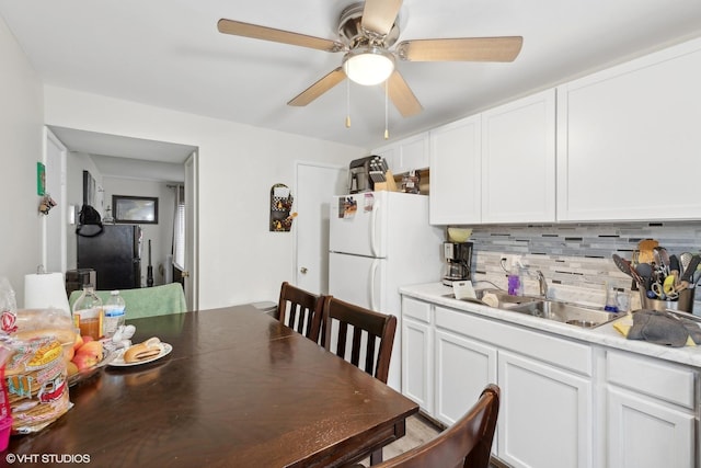 dining space featuring ceiling fan