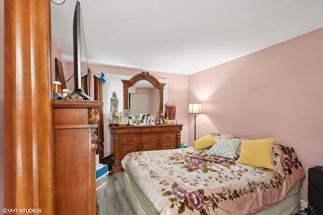 bedroom with wood finished floors